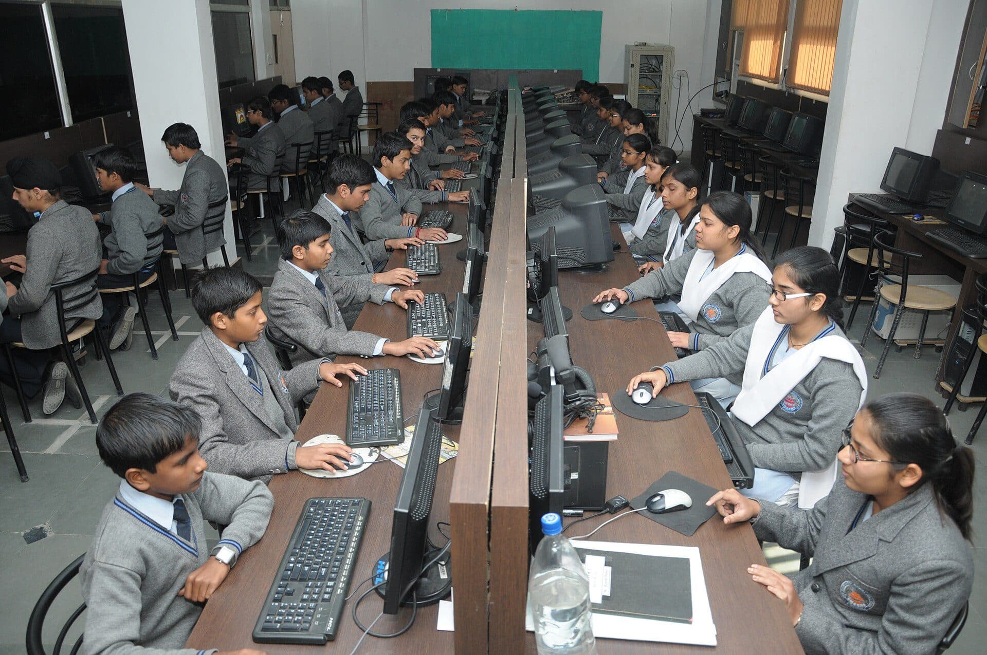 Students working at computers in a school computer lab