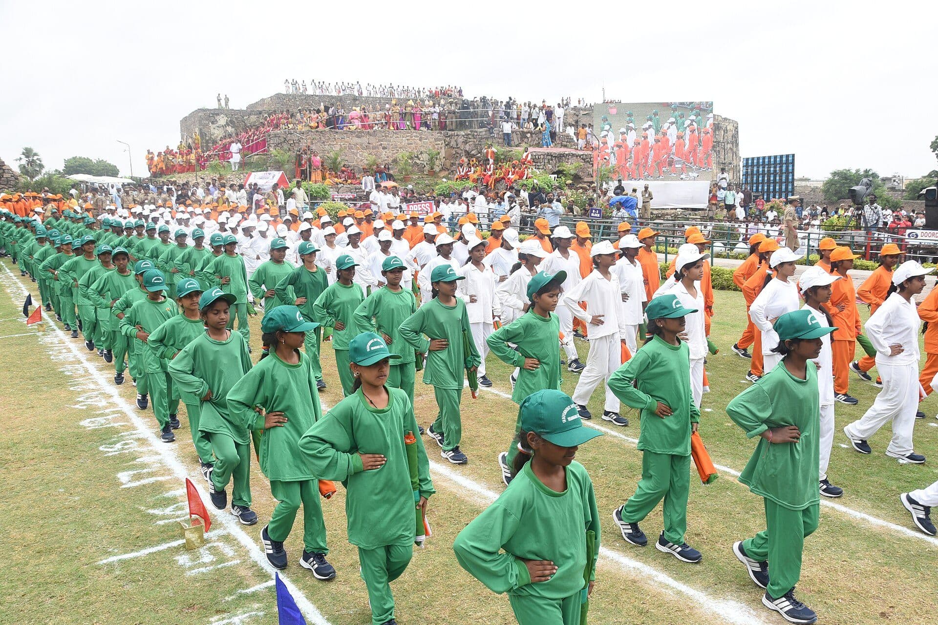 Students in green uniforms marching at Golconda Fort