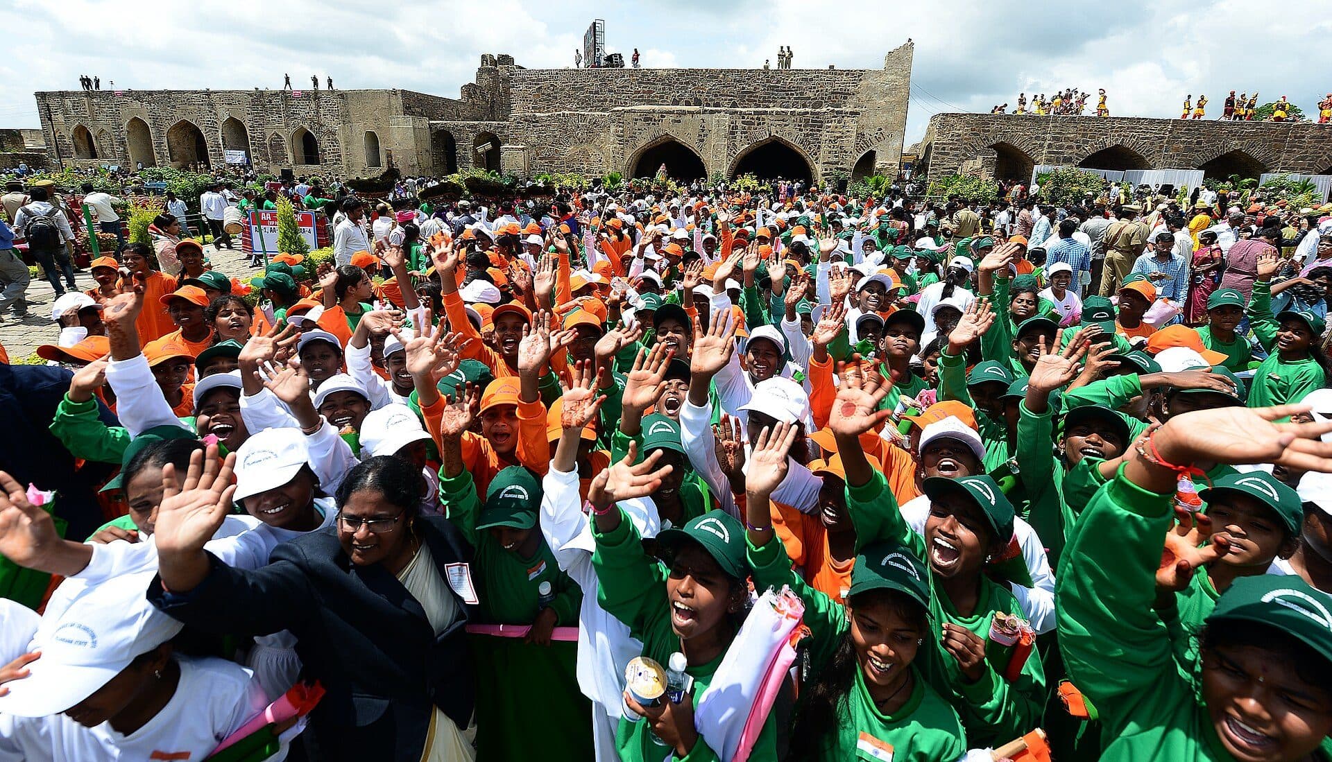Schoolchildren waving at the Independence Day celebrations at Golconda Fort